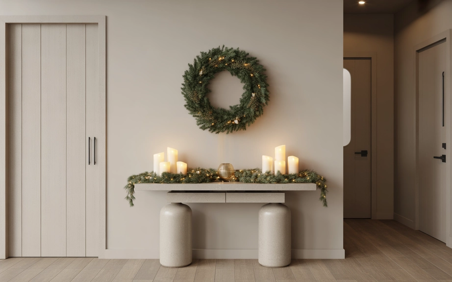 modern christmas entryway with simple greenery and candles